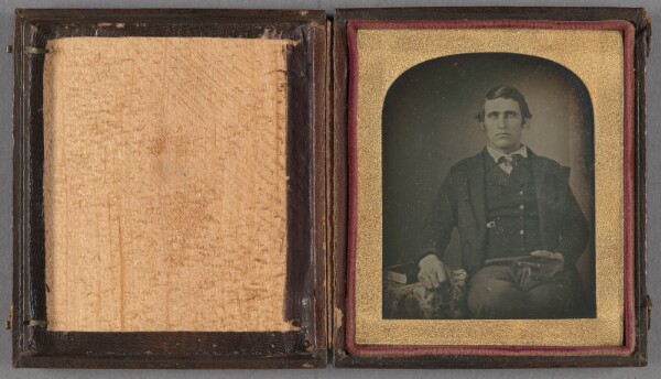 Unknown, [Portrait of a man seated holding a cased daguerreotype]