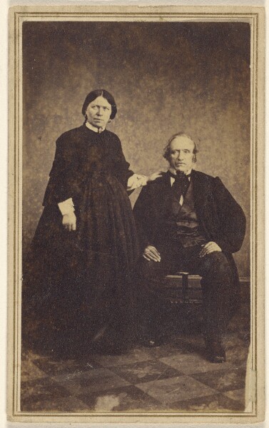 Unknown, [Unidentified couple: woman standing, man seated]