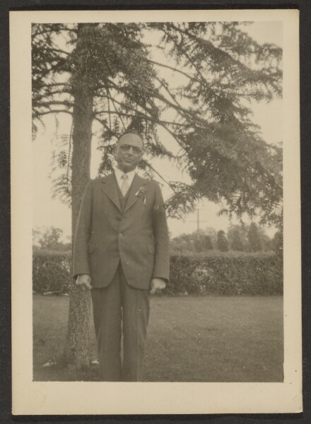 Louis Fleckenstein, [Man Standing by Tree]