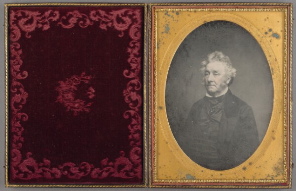 Unknown, [Portrait of a Seated Man with Curly Hair and Muttonchop Whiskers]