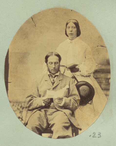 Unknown, [Portrait of a man and woman holding books]