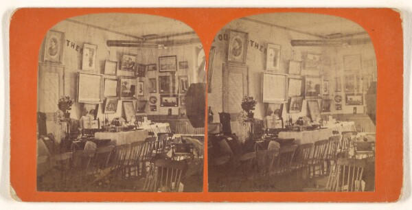 Unknown, [Interior of a room with numerous chairs, paintings on the walls]