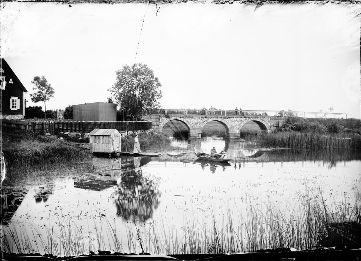 Skötsner-Edhlund, Rowing Boat a Pebble Bridge, Gimo, on the border between Hökdand Skäfthammar parish, Uppland