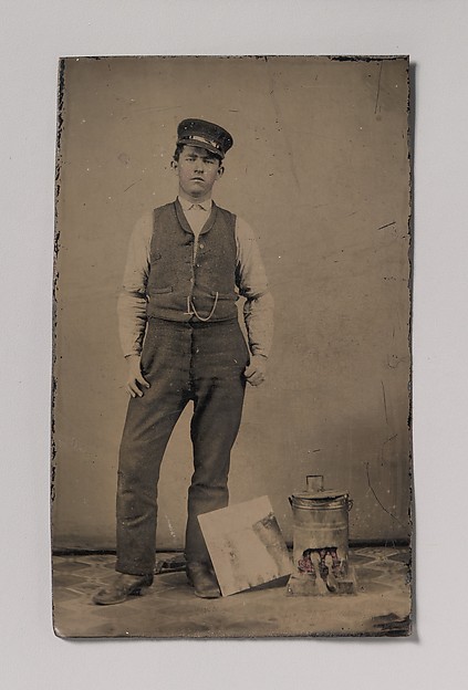 Unknown, [Tinsmith with Coal Heater and Sheet of Tin]
