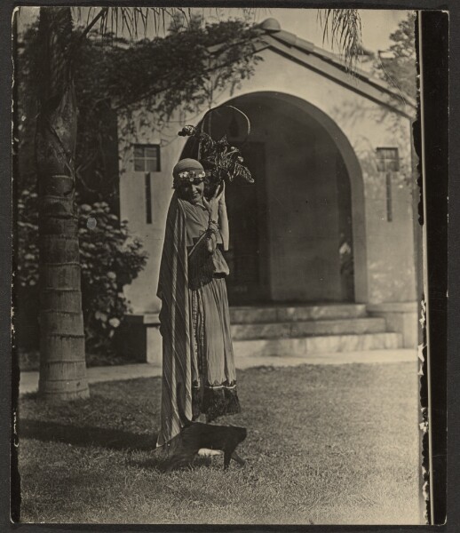 Louis Fleckenstein, [Florence in Costume with Plant Outside House]