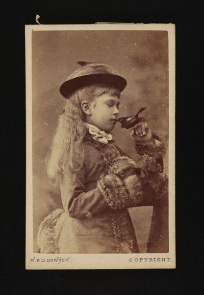 W. & D. Downey, A portrait of a girl holding a bird