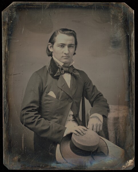 Unknown, [Portrait of a Seated Man with Hat on Lap]