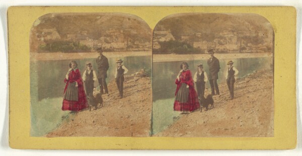 Unknown, [Family walking along shoreline with pet dog]