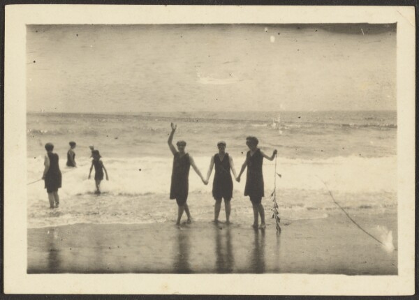 Louis Fleckenstein, [Figures on a Beach Holding Seaweed]