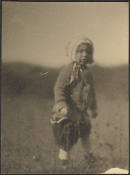 Louis Fleckenstein, [Child Wearing a Bonnet in Field]