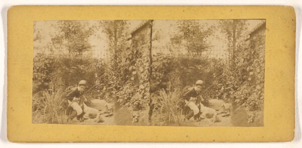 Unknown, [Boy in riding outfit playing in garden]