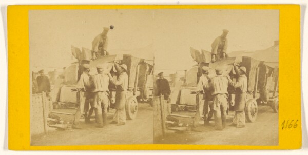 Unknown, [Men loading sheet metal on a truck]