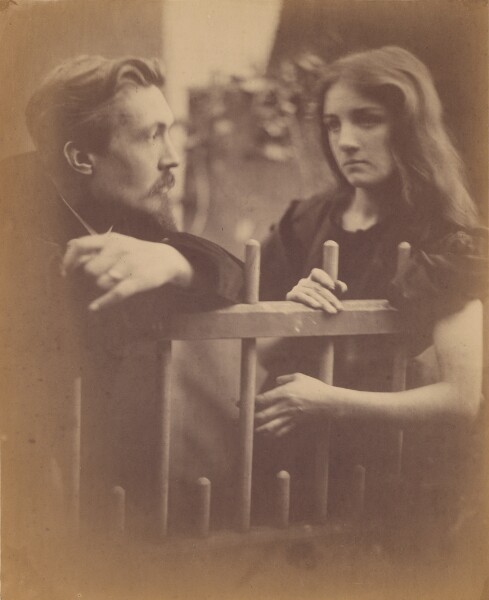 Julia Margaret Cameron, [Young man and woman leaning on a picket fence]
