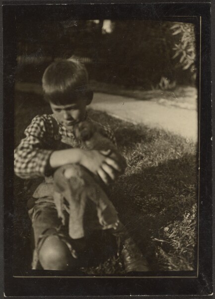 Louis Fleckenstein, [Boy Holding Small Animal]