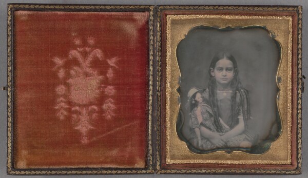 Unknown, [Portrait of a seated girl with long ringlets, holding a doll]