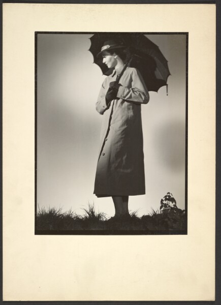 Günther Krampf, [Woman in coat with umbrella]