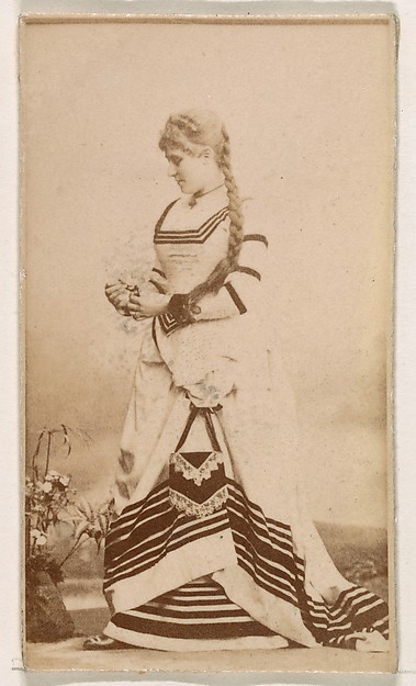 Kinney Brothers Tobacco Company, Standing actress in striped gown, from the Actresses series (N245) issued by Kinney Brothers to promote Sweet Caporal Cigarettes