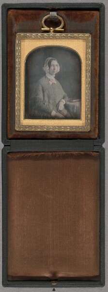 Unknown, [Portrait of a young woman wearing a floral bonnet, seated]