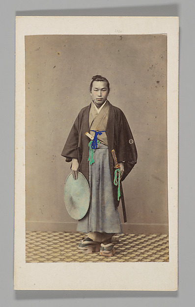 Felice Beato, [Japanese Naval Officer]
[Studio Portrait: Japanese Man (Tateise Onogero) Standing Holding Hat and Sword]