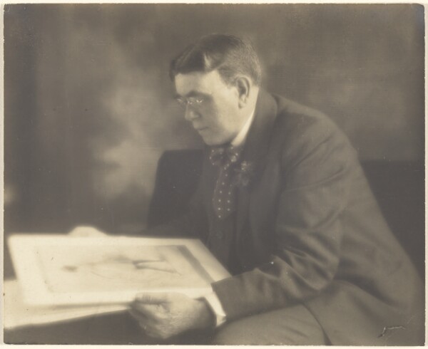 Louis Fleckenstein, [Self-Portrait in Studio Contemplating a Photograph of a Young Girl]
