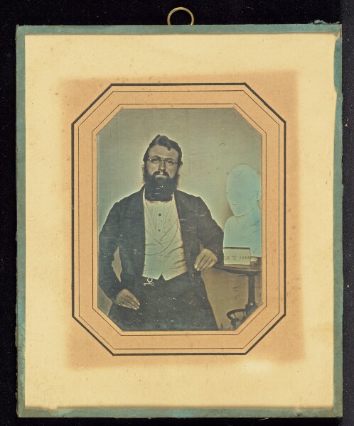 Unknown, [Portrait of a Bearded Man Wearing Wire-Rimmed Glasses seated next to a Bust of Voltaire by Houdon]