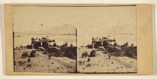 Francis Frith, [Man seated by thatched-roof hut in desert]