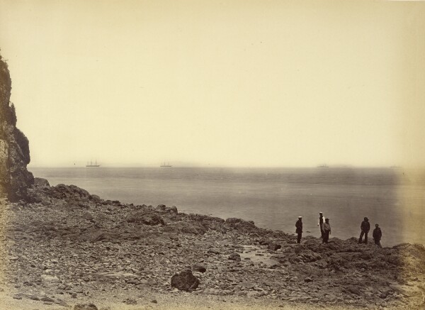 Felice Beato, [View of shore with ships on horizon and five figures standing on beach]