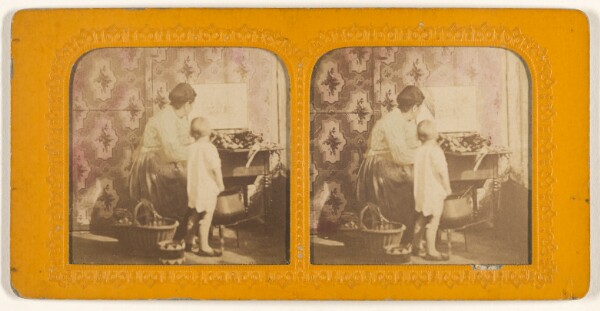 Unknown, [Mother preparing food at table, little child next to her]
