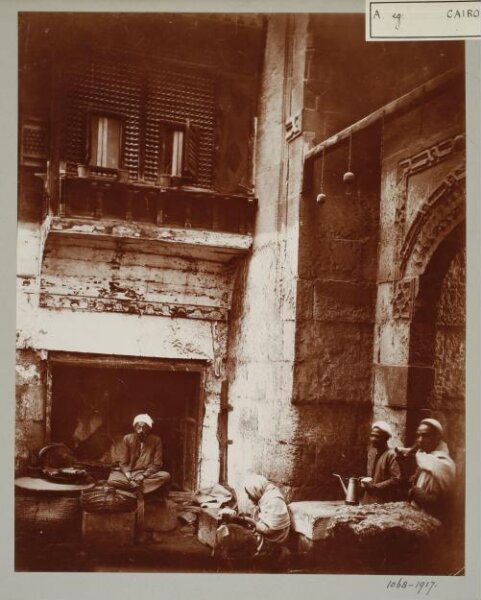 Unknown, People sitting infront of a shop, Cairo