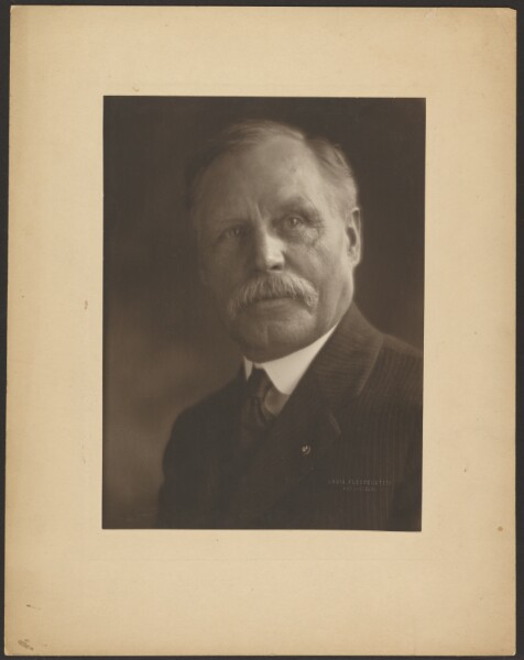 Louis Fleckenstein, [Portrait of a Man with Metal Lapel Pin]