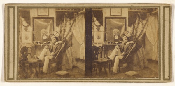 Unknown, [Unidentified couple: man with moustache seated with a woman hugging him, standing]