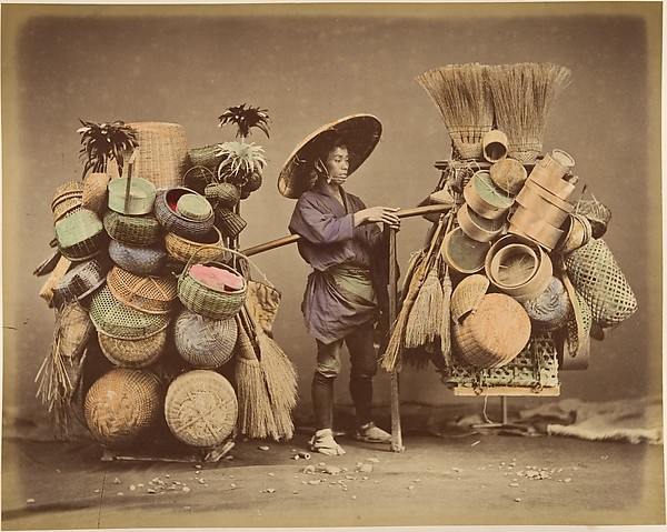 Unknown, [Japanese Man Posing with Baskets, Brooms and Feather Dusters]