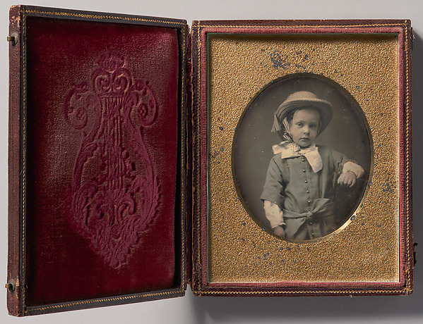 Unknown, [Child Wearing Straw Hat, Arm Resting on Table]