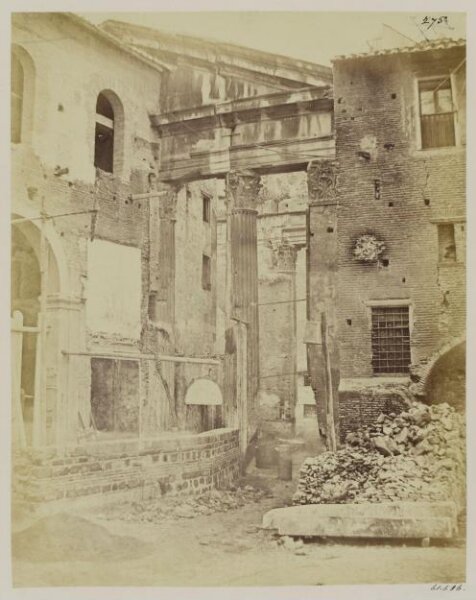 Parker, John Henry, Gates - Porta Triumphalis of the Caesars (?) or entrance to the Portico of Octavia, now the Church of S. Angelo in Pescheria, taken in 1866 when the wall of the Church was rebuilding