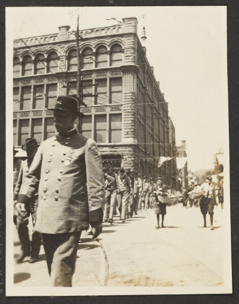 Unknown, [View of Veterans Marching in Parade]