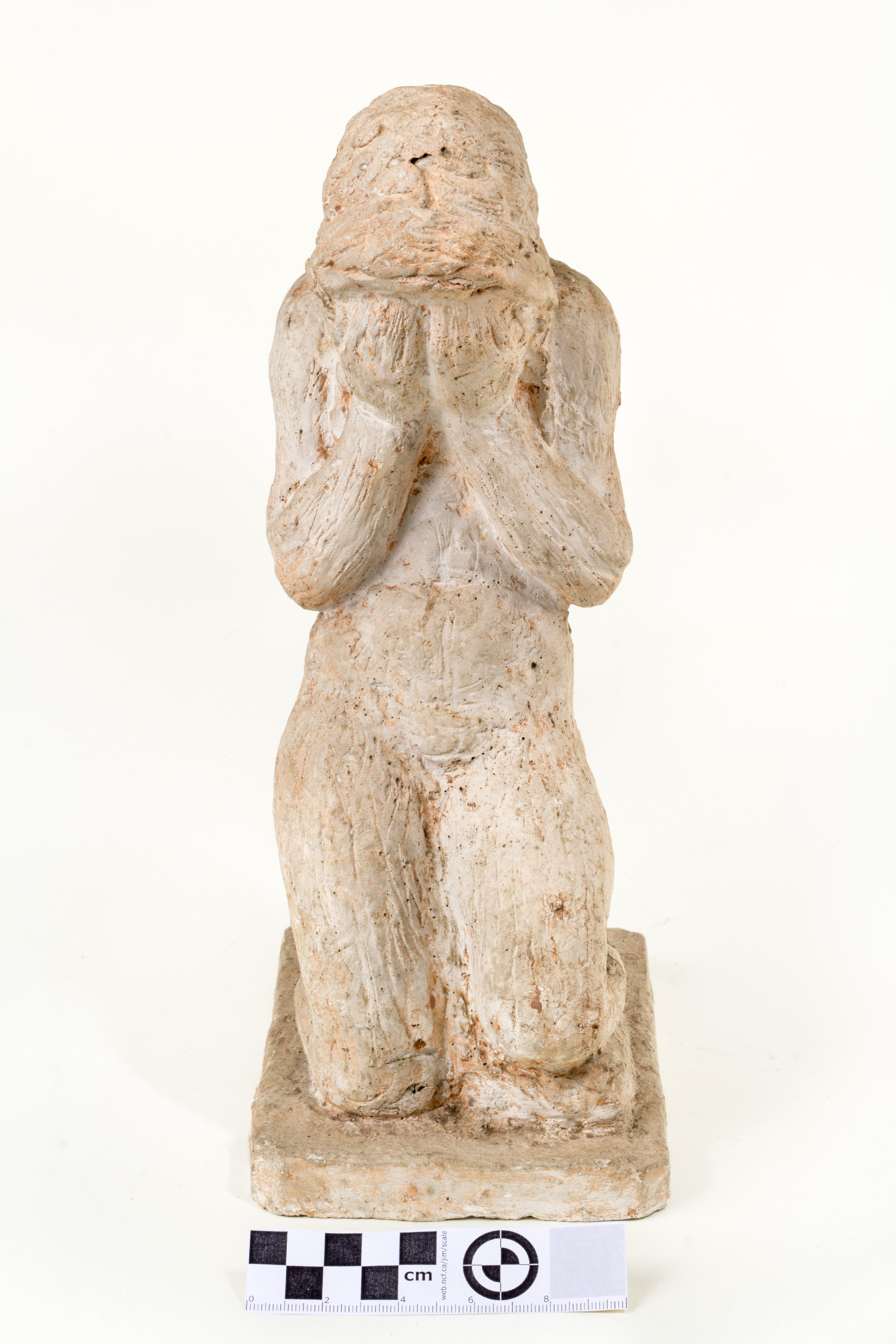 Anton (autor) Starkopf, kneeling woman