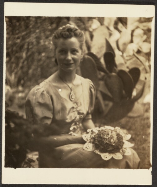 Louis Fleckenstein, [Woman Holding Bouquet Sitting before Cactus]