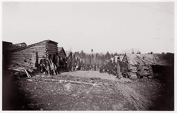 Unknown, [Winter Quarters of Unidentified Union Army Regiment with Two Rows of Log Cabins]