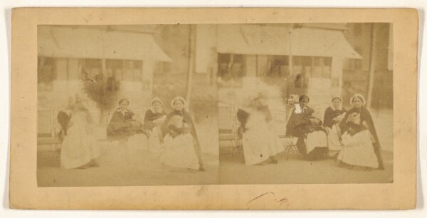 Unknown, [Group of women seated outside]
