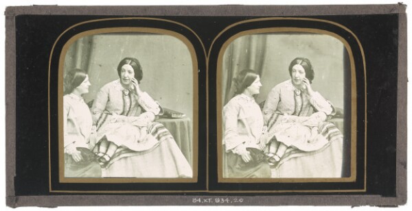 Unknown, [Two women seated, a child sleeping on lap of one of them]