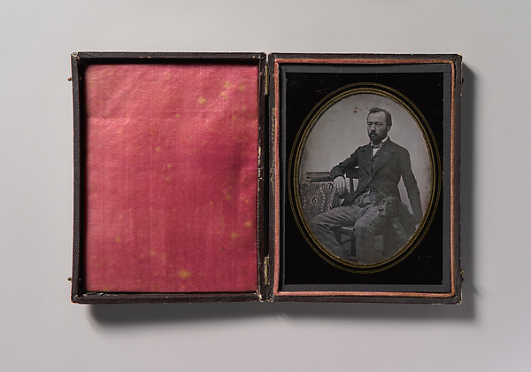 Unknown, [Man Seated at Table with Dog]