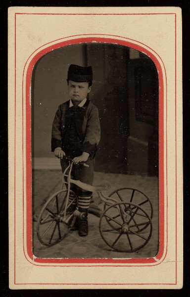 Unknown, [Portrait of a Boy in Cap with Tricycle]