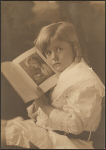 Louis Fleckenstein, [Portrait of Child Holding Book Open to Like Illustration]