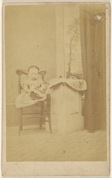 Unknown, [Unidentified little girl seated with a book in her lap]