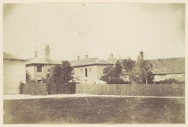 Unknown, [Compound of Buildings Surrounded by Fence]