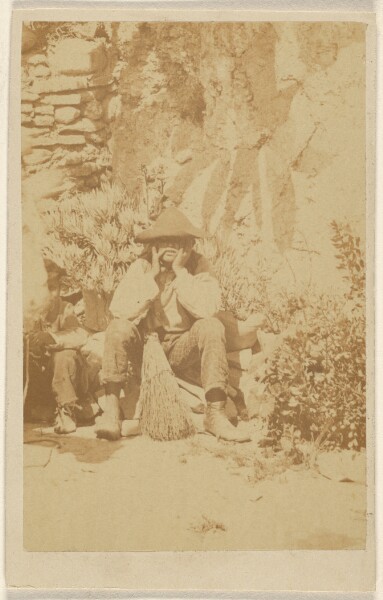 Unknown, [Unidentified man wearing a tricorn, seated, hands to face, a broom between his legs]