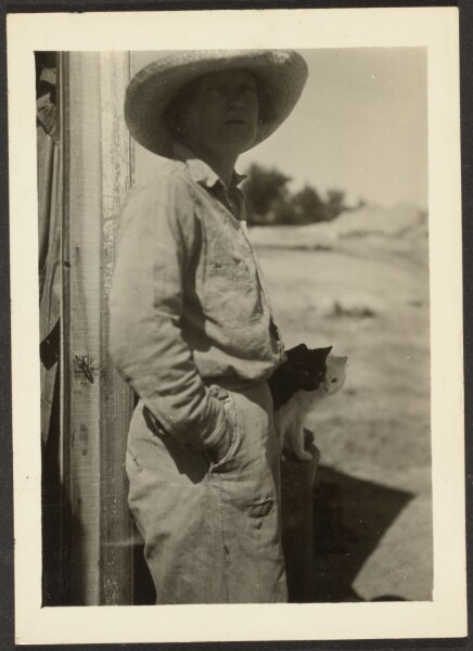 Louis Fleckenstein, [Woman Standing with Kittens]