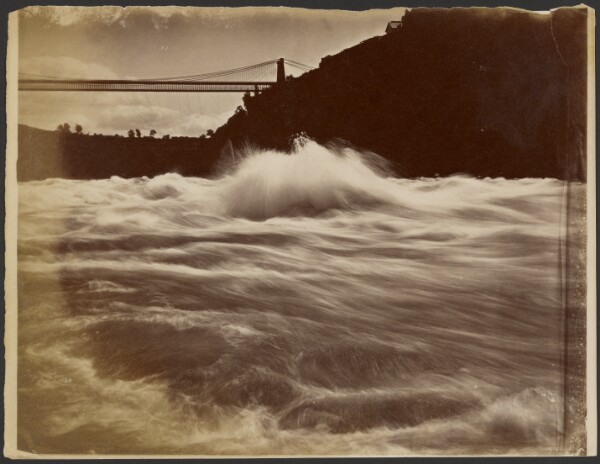 Unknown, [Rough waters below suspension bridge]