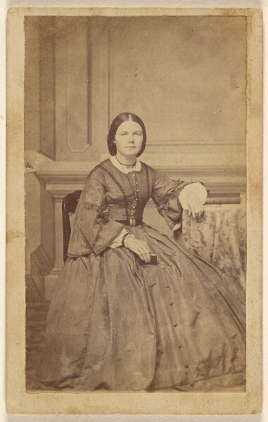 Unknown, [Unidentified woman holding small book, seated]