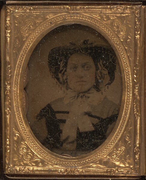 Unknown, [Woman wearing hat with bow tied shash]